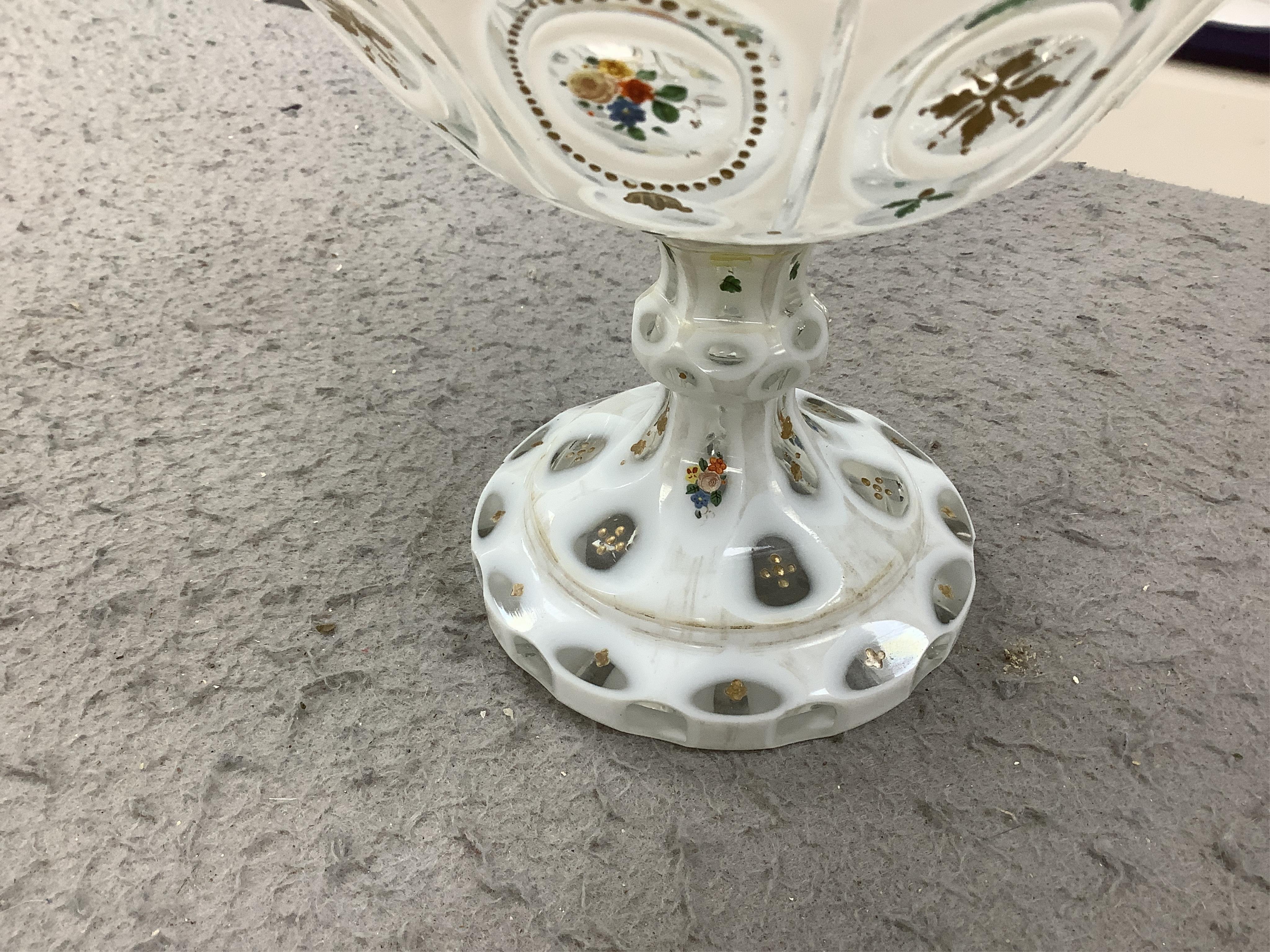 A pair of late 19th century Bohemian enamelled overlaid glass vases, and a similar overlaid glass comport. Condition - vases fair; comport poor